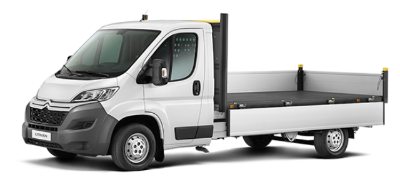 White flatbed truck viewed from the side and front.